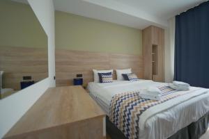 Postel nebo postele na pokoji v ubytování 4Guest Hotel