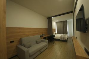 TV a/nebo společenská místnost v ubytování 4Guest Hotel