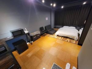 Postel nebo postele na pokoji v ubytování P-Stay 広島八丁堀 201号室