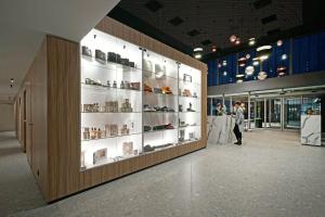 a person walking through a display case in a store at MY HOTEL MALMEDY in Malmedy