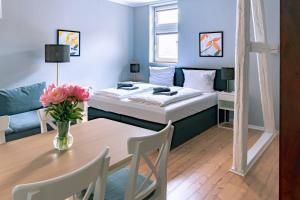 En eller flere senge i et værelse på CBlue "Apartmenthaus Captain Hook"