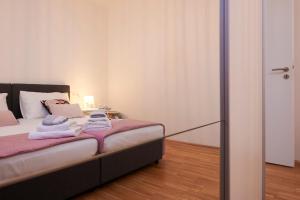 Postel nebo postele na pokoji v ubytování New 4* apartman Zoa in Trogir
