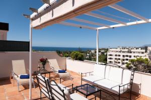 Balkón alebo terasa v ubytovaní Guadalpin Suites