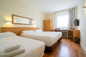 Posteľ alebo postele v izbe v ubytovaní Hotel YIT Ciudad de Elche