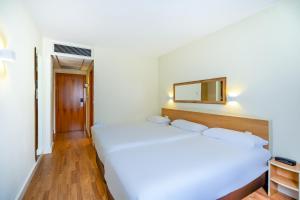 Posteľ alebo postele v izbe v ubytovaní Hotel YIT Ciudad de Elche
