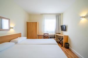Posteľ alebo postele v izbe v ubytovaní Hotel YIT Ciudad de Elche
