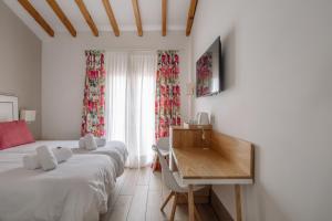 TV a/nebo společenská místnost v ubytování Rosal by Seaward Suites