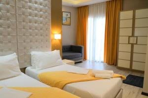 Postel nebo postele na pokoji v ubytování Hotel Strora