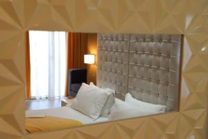 Postel nebo postele na pokoji v ubytování Hotel Strora