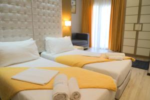 Postel nebo postele na pokoji v ubytování Hotel Strora