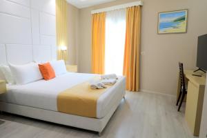 Postel nebo postele na pokoji v ubytování Hotel Strora