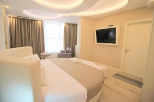 Postel nebo postele na pokoji v ubytování Hotel Strora