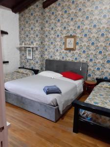 Postel nebo postele na pokoji v ubytování B&B VILLA LUPIDI