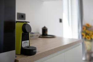 a hair dryer sitting on top of a kitchen counter at Residence soleluna - Appartamento Orsa Minore in Roisan