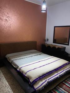 Voodi või voodid majutusasutuse Dar kouka toas