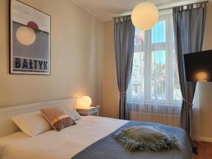 Posteľ alebo postele v izbe v ubytovaní Apartament Śliwka na Monte