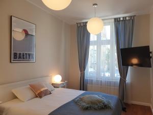 Posteľ alebo postele v izbe v ubytovaní Apartament Śliwka na Monte