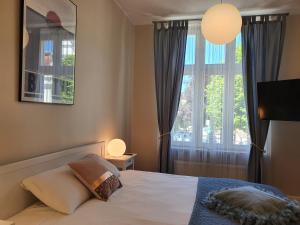 Posteľ alebo postele v izbe v ubytovaní Apartament Śliwka na Monte