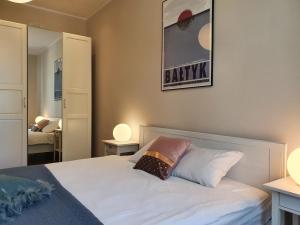 Posteľ alebo postele v izbe v ubytovaní Apartament Śliwka na Monte