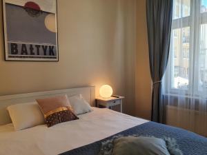 Posteľ alebo postele v izbe v ubytovaní Apartament Śliwka na Monte