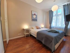 Posteľ alebo postele v izbe v ubytovaní Apartament Śliwka na Monte