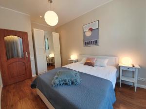 Posteľ alebo postele v izbe v ubytovaní Apartament Śliwka na Monte