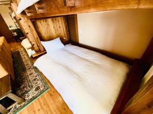 an overhead view of a bed in a room at villa garden DaiDai in Hiroshima