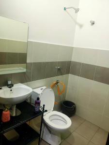 a bathroom with a toilet and a sink at Swedish Style Homestay in Teluk Intan +15 photos