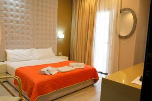 Postel nebo postele na pokoji v ubytování Hotel Strora
