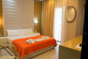 Postel nebo postele na pokoji v ubytování Hotel Strora