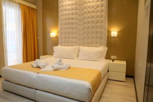 Postel nebo postele na pokoji v ubytování Hotel Strora