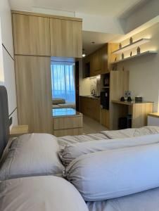 Η κουζίνα ή μικρή κουζίνα στο Paradise Inn 1105 Pollux Habibie Batam