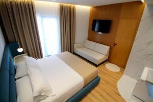 Postel nebo postele na pokoji v ubytování Hotel Strora
