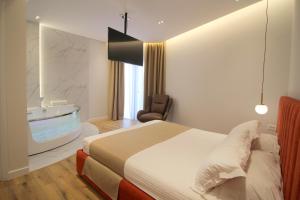Postel nebo postele na pokoji v ubytování Hotel Strora