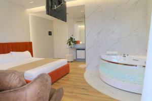 Postel nebo postele na pokoji v ubytování Hotel Strora