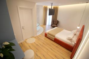 Postel nebo postele na pokoji v ubytování Hotel Strora