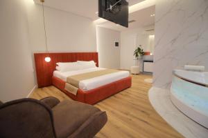 Postel nebo postele na pokoji v ubytování Hotel Strora