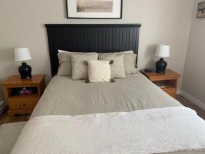 En eller flere senge i et værelse på Condo de Jean et Chantale