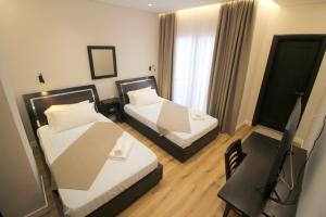 Postel nebo postele na pokoji v ubytování Hotel Strora