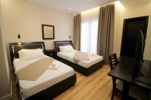 Postel nebo postele na pokoji v ubytování Hotel Strora