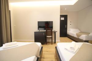 Postel nebo postele na pokoji v ubytování Hotel Strora