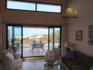 a living room with a couch and chairs and a table at Exclusive Penthouse Privacy and Sea View in Vistamar KniTorroxCosta in Torrox Costa