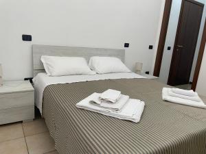 Postel nebo postele na pokoji v ubytování Ospitaci - Via Pertichetti