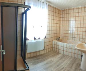 a bathroom with a shower and a tub and a sink at Villa Monette -Le Crotoy in Le Crotoy +8 photos
