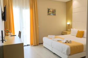 Postel nebo postele na pokoji v ubytování Hotel Strora