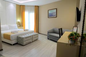 Postel nebo postele na pokoji v ubytování Hotel Strora