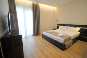 Postel nebo postele na pokoji v ubytování Hotel Strora
