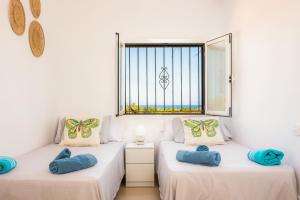 Giường trong phòng chung tại Finca Blanca +22 ảnh