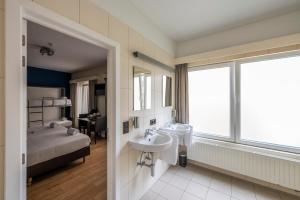 Postel nebo postele na pokoji v ubytování Hotel Onderbergen
