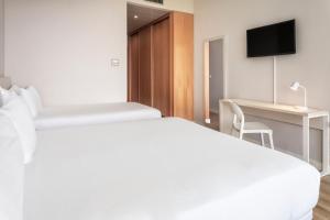 Un ou plusieurs lits dans un hébergement de l'établissement B&B HOTEL Cantanhede Coimbra